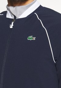 Lacoste Sport Bomber bunda - dark blue