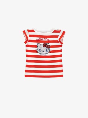 Chemise à manches courtes rayée rouge et blanche avec un visage de Hello Kitty en sequins et le texte rouge « Hello Kitty » au-dessus, texte « Monnalisa » en dessous.