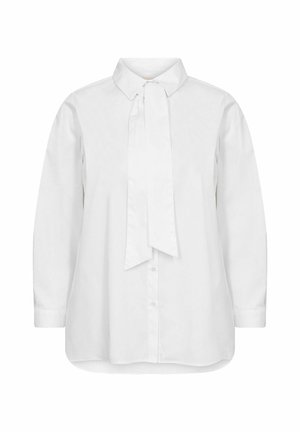 Chemisier en coton blanc à manches longues, col classique, et un nœud attaché au cou. Présente une patte de boutonnage et une coupe décontractée.