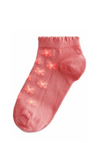 Rosa ankelsocka med ribbad mudd, med ett mönster av små, ljusrosa blommor över ytan. Tyget verkar mjukt och texturerat.