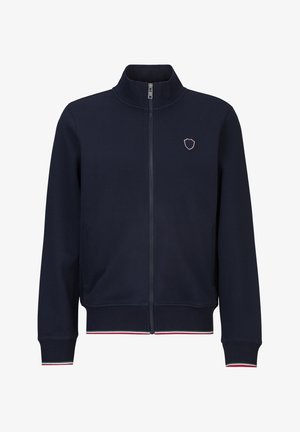 Marineblauwe jas met ritssluiting, hoge kraag, klein schildembleem op de linkerborst en rood-wit-groene bies aan manchetten en zoom.