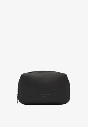 Pochette cosmetica nera realizzata in materiale morbido con forma arrotondata, dotata di una cerniera argento e logo del brand impresso sul frontale.