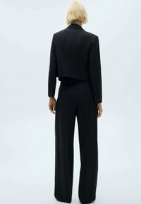 Mango SMOCK - Nohavice - black