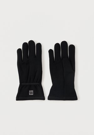 Une paire de gants isolés noirs posés à plat, l'un montrant le côté paume et l'autre le dos, sur un fond blanc uni.