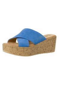 Sandales en liège avec talon compensé, à lanières croisées en suede bleu, ouvertes sur les orteils, et semelle en liège texturée pour une meilleure adhérence.