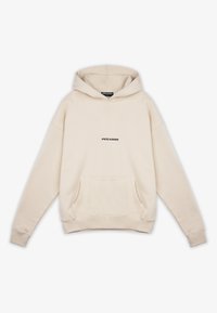 Kremowa bluza z kapturem z kieszenią z przodu, sznurkiem do ściągania i czarnym logo "PEGADOR" na klatce piersiowej. Miękki materiał przypominający dres.