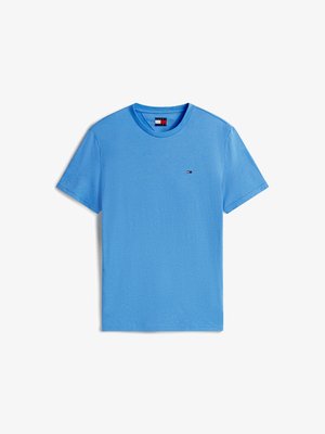 Light blue short-sleeve t-shirt made of cotton; features a small embroidered logo in red, white, and blue on the chest; smooth texture.