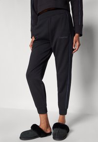 Calvin Klein Underwear FRENCH TERRY LOGOPANTS - Spodnji del pižame - black