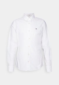 Camicia bianca button-up in cotone. Presenta un colletto a punta, maniche lunghe e bottoni color beige chiaro. Piccolo logo ricamato sul petto.