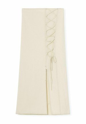 Beige cotton skirt featuring a side slit and corset-style lacing detail along the left seam. Flat, clean edges and smooth texture.