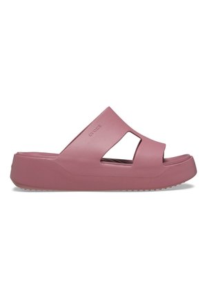 Sandal med mat mauve, tyk sål, åben tå og stor udskæring på siden for ventilation og nem påtagning.