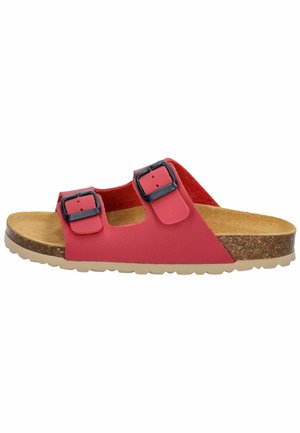 Red slip-on sandal with two black adjustable buckles, cork footbed, and textured rubber outsole. Flat design suitable for casual wear.