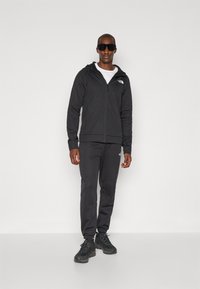 The North Face REAXION HOODED FULL ZIP JACKET - Športna jakna/jopica - black heather
