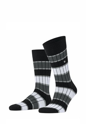 Schwarz-weiße und graue gestreifte Socken in Knöchellänge mit Rippenstruktur, stehend auf weißem Hintergrund dargestellt.
