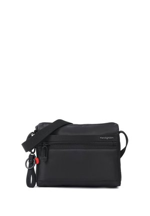 Black rectangular crossbody bag with front zipper pocket, adjustable strap, and Hedgren logo on upper right side.