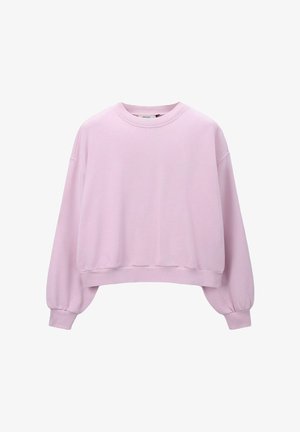 Sweat-shirt oversize rose pâle avec poignets et ourlet côtelés, encolure ronde et coupe décontractée.
