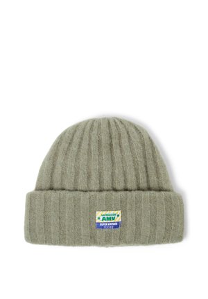Green ribbed knit beanie hat with folded cuff and rectangular multicolor fabric brand label on front.