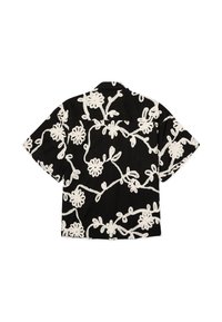 Chemise noire à manches courtes avec broderie florale blanche et col, présentée à plat vue de dos.