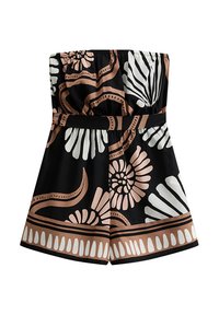 Combinaison sans bretelles noire avec des motifs floraux et abstraits en blanc et en rose pâle. Taille élastique avec une bande décorative et design à jambes larges.