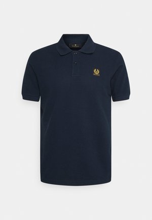Navy blue polo shirt made of cotton with a classic collar, two-button placket, and a gold emblem on the left chest. Short sleeves.