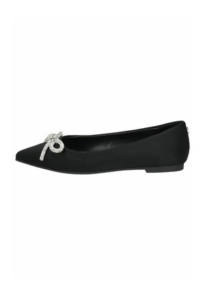 Black flat shoe with a pointed toe and a decorative rhinestone bow on the vamp, featuring a smooth matte texture and a low heel.