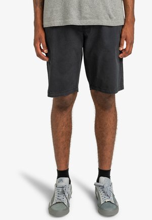 Black cotton shorts with a relaxed fit, knee-length, featuring a simple design, straight hem, and subtle stitching details.