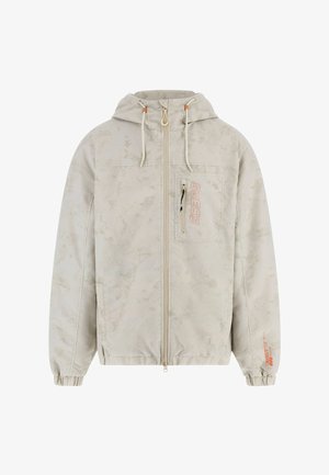 Lys beige jakke med et tekstureret mønster, lynlås foran, justerbar hætte, elastiske manchetter og et orange logo på brystlommen.