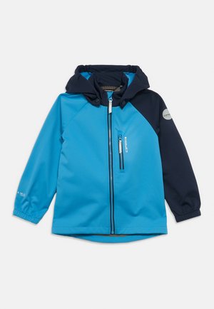 Veste imperméable bleu et marine avec capuche, fermeture éclair à l'avant et poignets élastiques. Comprend une poche latérale et des détails avec le logo.