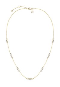 Zlatý náhrdelník s několika průhlednými drahokamy rovnoměrně rozmístěnými po celé délce, s bezpečnou sponou a značkovou visačkou.