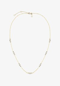 Geselecteerd, gold-coloured