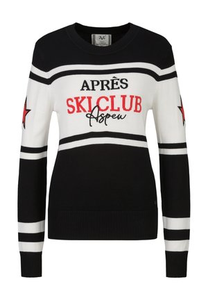 Pull noir et blanc avec des étoiles rouges sur les manches et le texte "Après Ski Club Aspen" sur la poitrine en lettres noires et rouges.