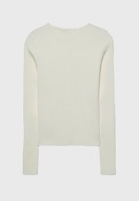 Cream ribbed knit sweater with long sleeves and a rounded neckline. Features a relaxed fit and a straight hem with slight side slits.