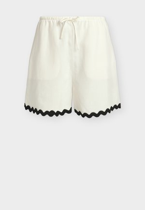 Λευκά άνετα σορτς με ελαστική μέση και κορδόνι, με μαύρη κυματιστή λεπτομέρεια στο τελείωμα.