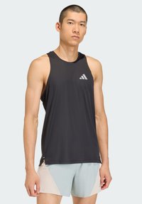 Black athletic tank top made of lightweight fabric, featuring a round neckline and a small white Adidas logo on the left chest.