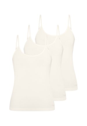 Quatre débardeurs blancs sans couture avec bretelles spaghetti, disposés en rangée légèrement chevauchante sur un fond blanc.