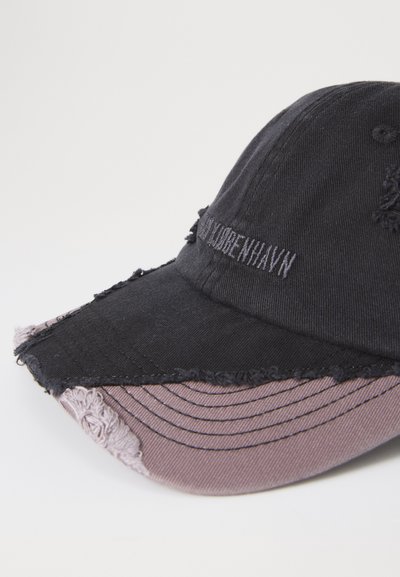 Black and faded purple distressed baseball cap with frayed edges and embroidered text on the front panel.