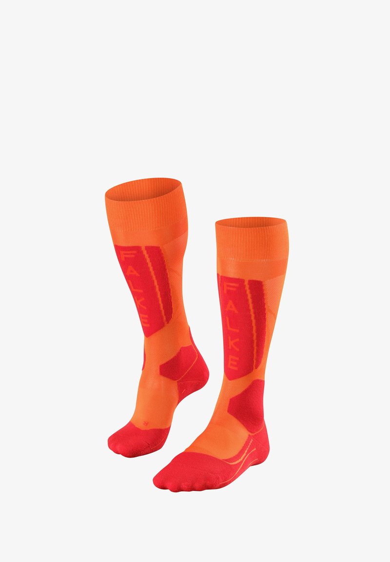 Calze alte fino al ginocchio arancioni e rosse con un motivo testurizzato e un evidente marchio "FALKE", con accenti di colore contrastante sulla punta e sul tallone.