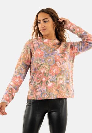 Pull en tricot multicolore présentant un motif floral dans des tons de rose, violet et vert. Manches longues avec des poignets côtelés et un col rond.