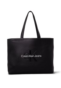Czarna torba na ramię wykonana z gładkiego syntetycznego materiału. Posiada wysokie uchwyty oraz wytłoczone logo "CK" z napisem "Calvin Klein Jeans" z przodu.