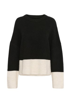 Suéter color bloque en negro y crema, con cuello redondo, mangas largas y un corte holgado. Fabricado con material de punto suave y texturizado.