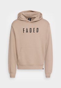 Felpa beige con tasca frontale, testo "FADED" in nero. Dotata di cappuccio con stringhe e polsini a coste sulle maniche e sull'orlo inferiore.
