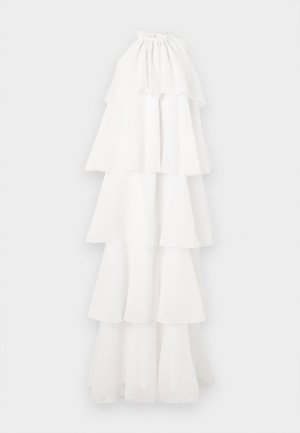 White tiered dress made of lightweight fabric. It features a halter neckline and multiple ruffled layers, creating a flowing silhouette.