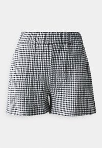 Shorts en vichy noir et blanc avec une ceinture élastique, dotés d'un tissu texturé et d'une coupe ajustée.