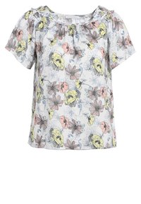 Bloes met korte mouwen in bloemenprint, met een witte achtergrond en kleurrijke bloemenpatronen in roze, geel en blauw. Elastische halslijn en rimpelaccenten.