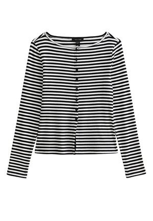 Haut à rayures horizontales noires et blanches, manches longues, boutonné sur le devant avec un col rond et de petits boutons noirs.