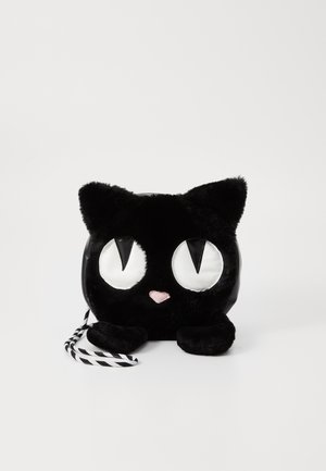 Black plush cat-shaped shoulder bag with white reflective eyes and a pink nose, featuring a striped black and white strap.