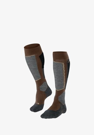 Calcetines hasta la rodilla en marrón, gris y negro; puños acanalados, talón y puntera reforzados, diseño segmentado con zonas acolchadas para mayor comodidad.