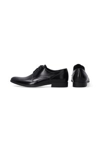 Zwarte leren kleding schoenen met een gladde afwerking, ronde neus, gesloten veters, subtiele zijnaad en een lage hak. Achteraanzicht inbegrepen.