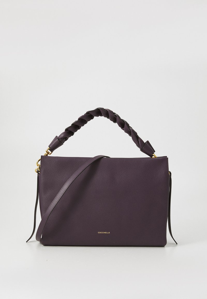 Purple leather handbag with a braided top handle, gold hardware, flat design, and a detachable shoulder strap. Features a logo on the front.