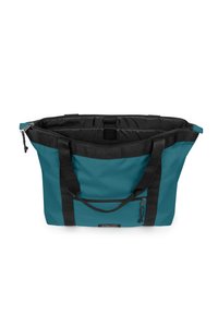 Tyrkysová a černá taška na rameno s horním zipem, dvěma černými popruhy a přední kapsou na zip, otevřená, aby ukázala vnitřní podšívku a přihrádky.